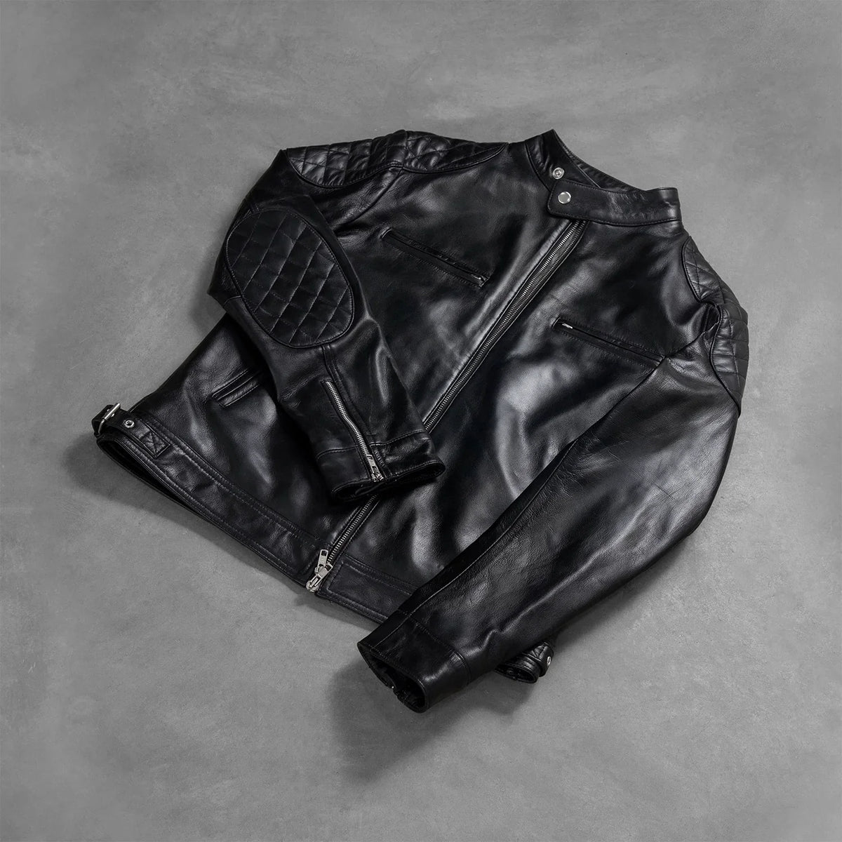 
Styled Fit Perspective of Men's Gatsby Quilted Black Leather Biker Jacket on Model - Natural Daylight Drape