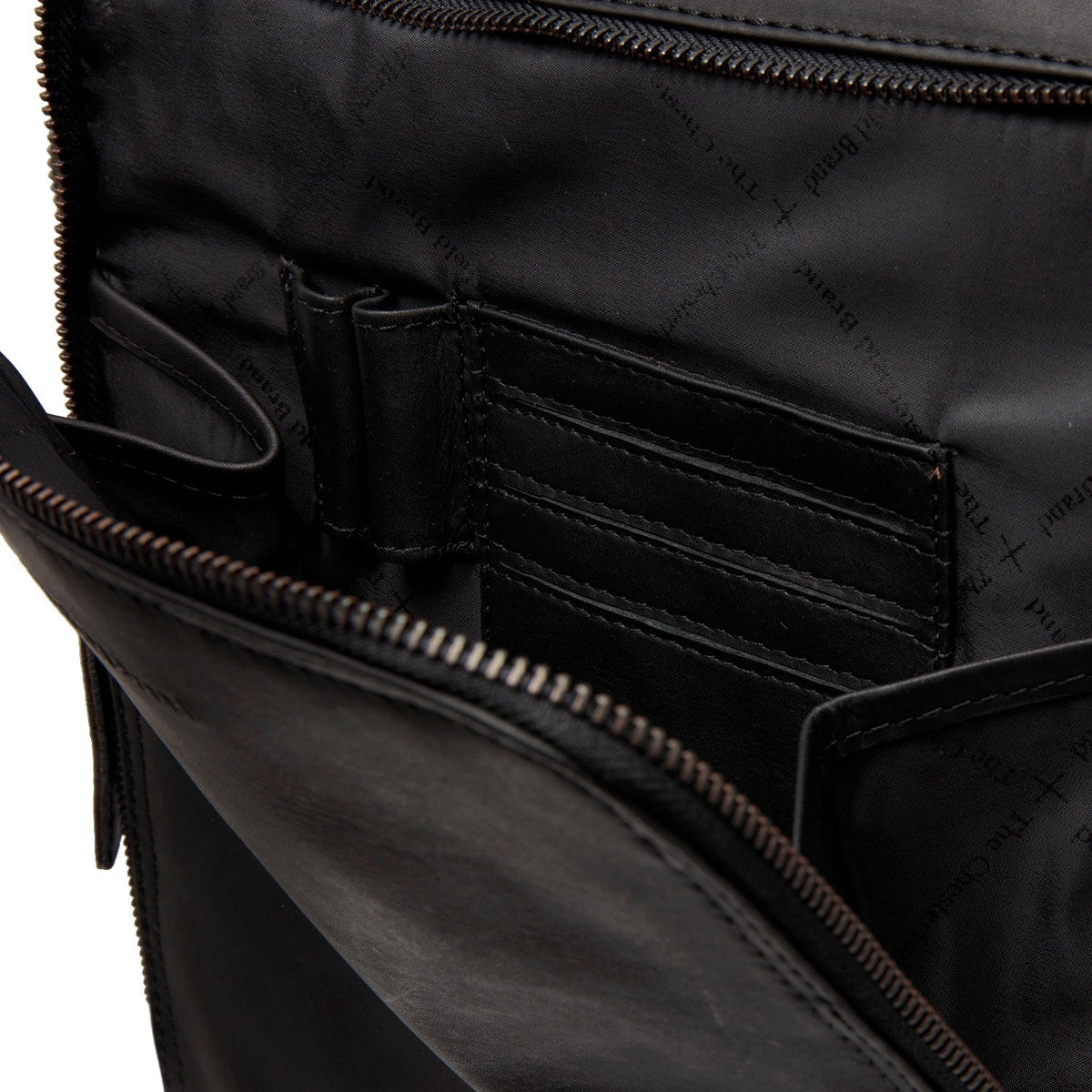 
Solid Antique Brass Hardware & Heavy-Duty Dual Zipper Detail on Jasper Full-Grain Leather Laptop Backpack