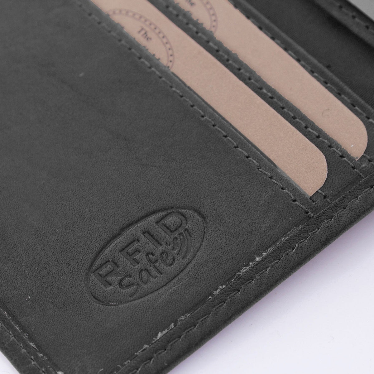 
Solid Antique Brass Hardware & Heavy-Duty Dual Zipper Detail on Hereford Full-Grain Leather Wallet