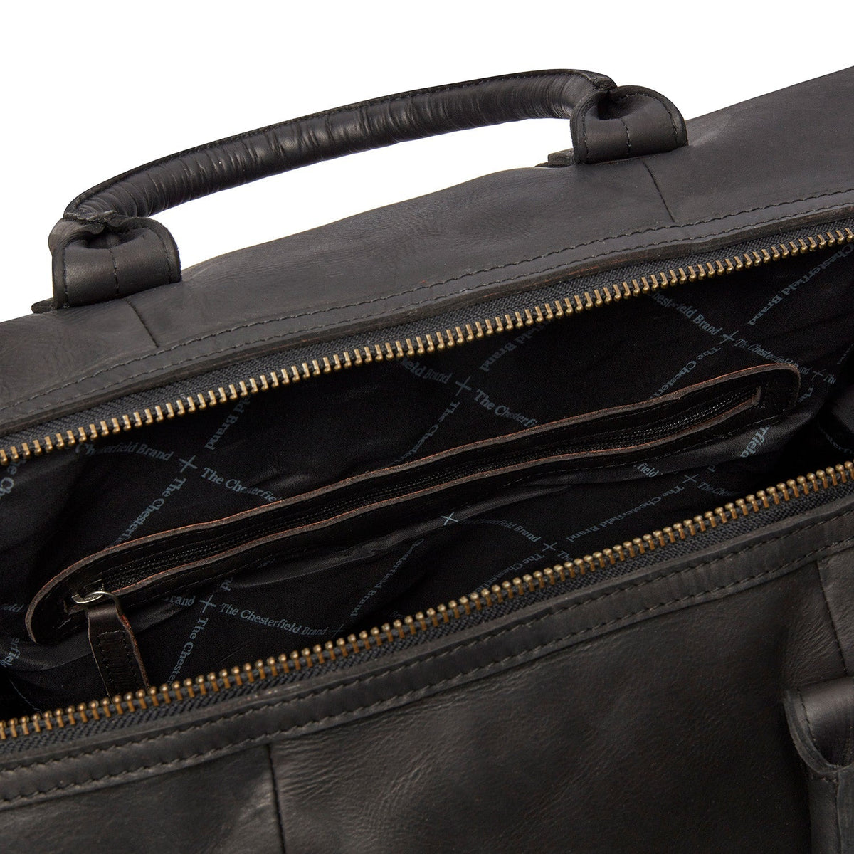 
Solid Antique Brass Hardware & Heavy-Duty Dual Zipper Detail on Portsmouth Full-Grain Leather Weekender Bag