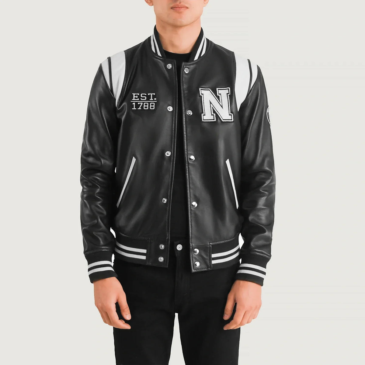 
Liberte New York Black Leather Varsity Jacket in Black & White Sheepskin Leather - Front Profile View & Tailored Silhouette | Buy Online