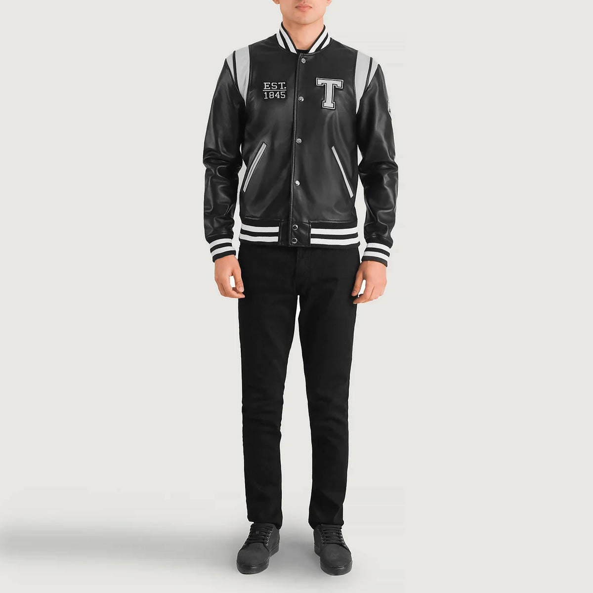 
Liberte Texas Black Leather Varsity Jacket - Lateral Side Profile View Showing Sleeve Cut & Athletic Taper Fit
